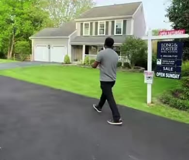 Adonay walking toward a grey colonial in Silver Spring