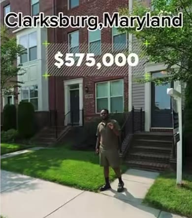 Brick townhome with a front lawn in Clarksburg