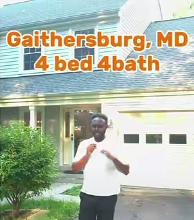 Adonay in front of a white garage in Gaithersburg