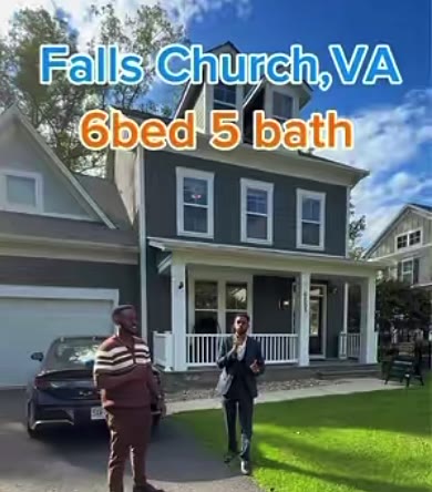 Navy two-storey home with a front porch in Falls Church