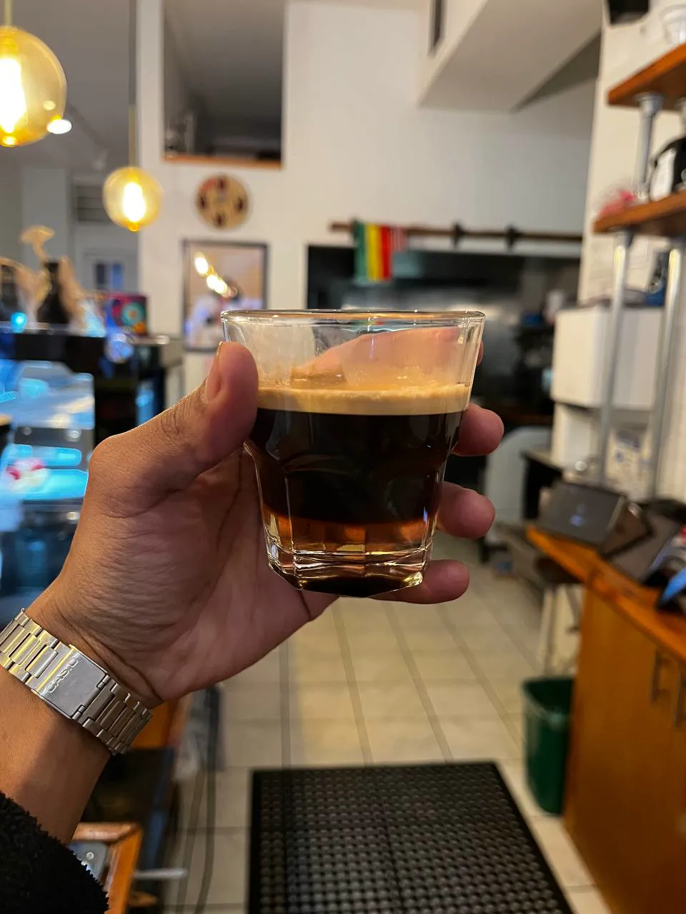 A short glass of espresso with golden crema