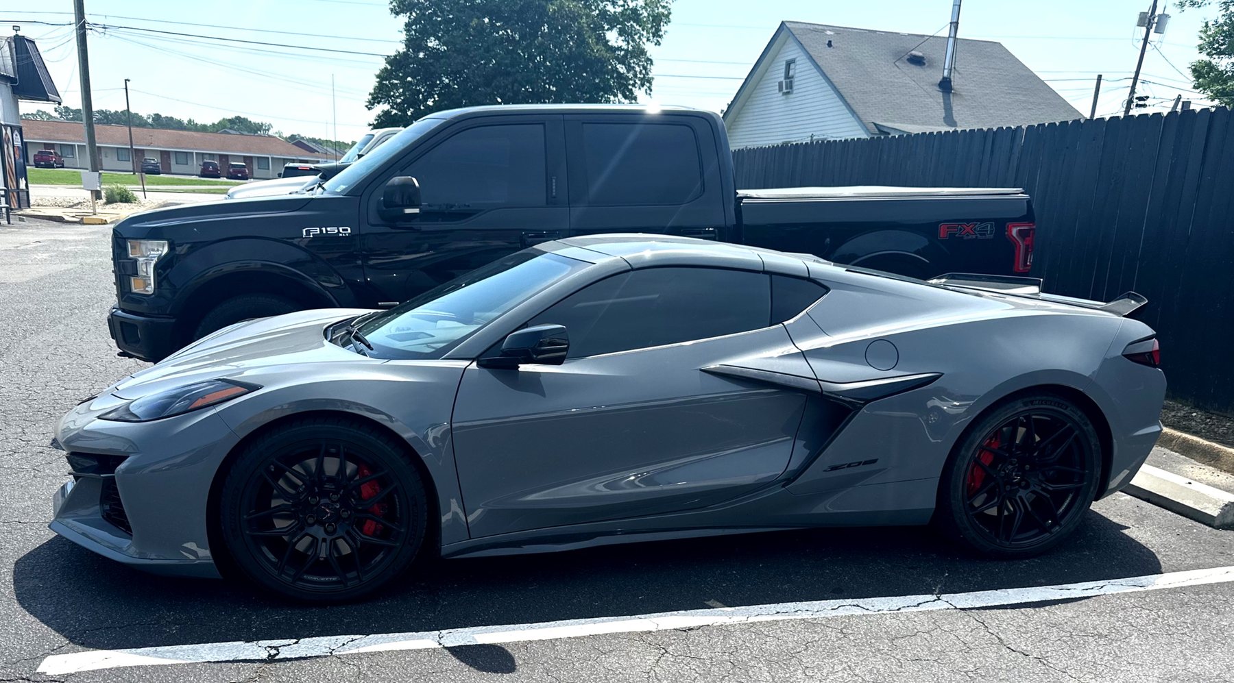 Grey Corvette with tinted windows outside The Tint Doctor