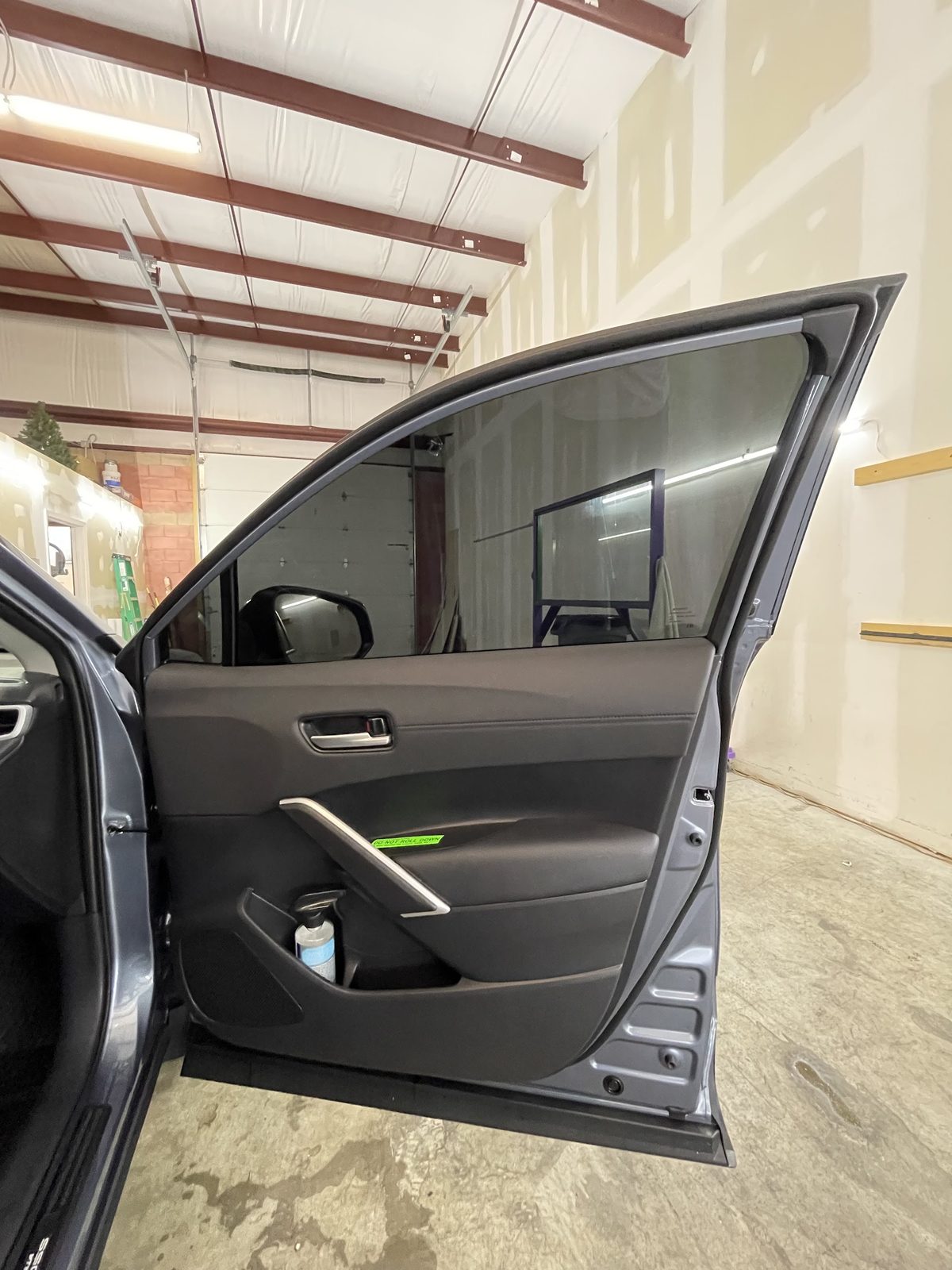 Open door showing fresh tint on the side window