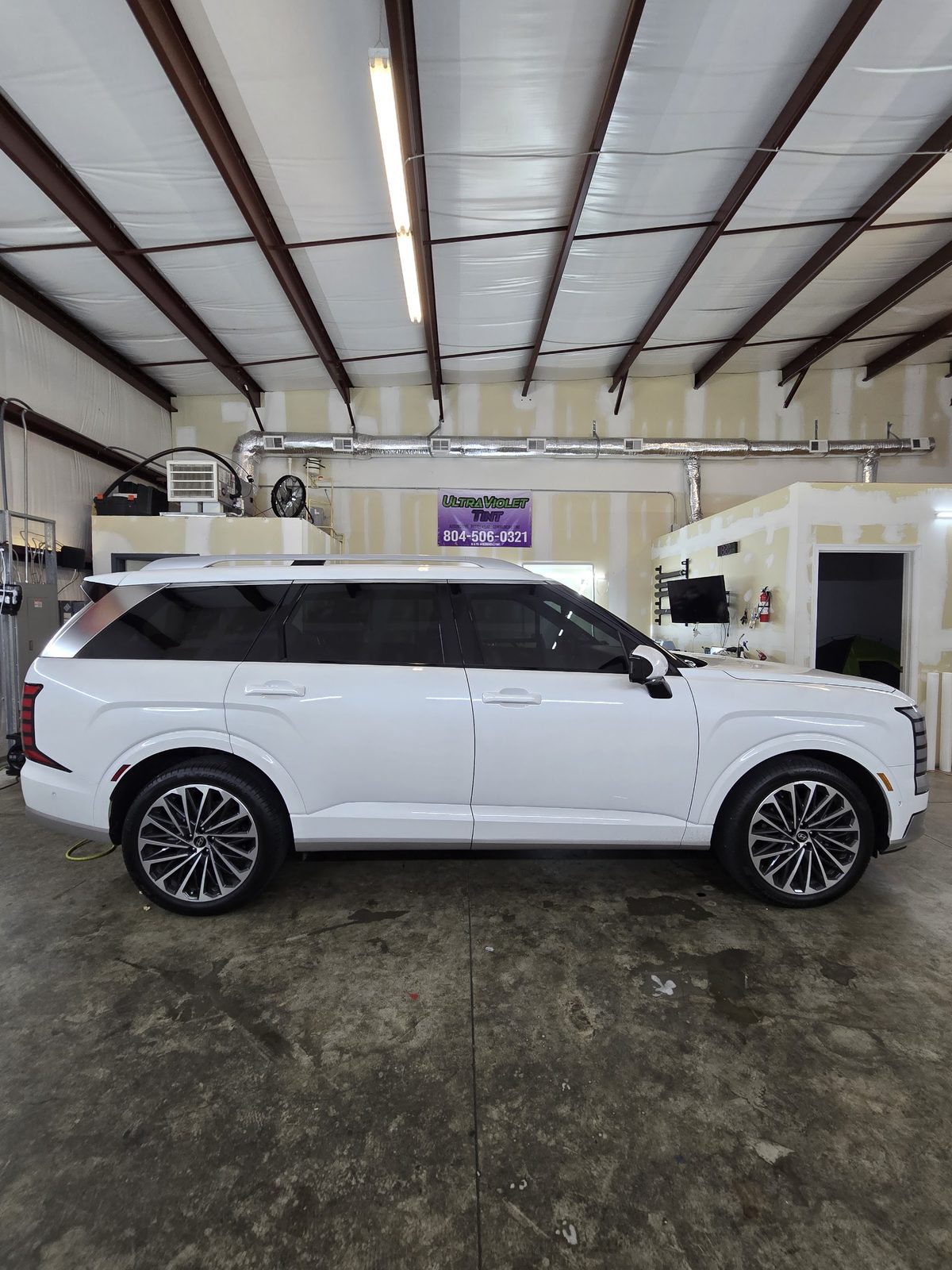 White SUV with tinted windows in the bay